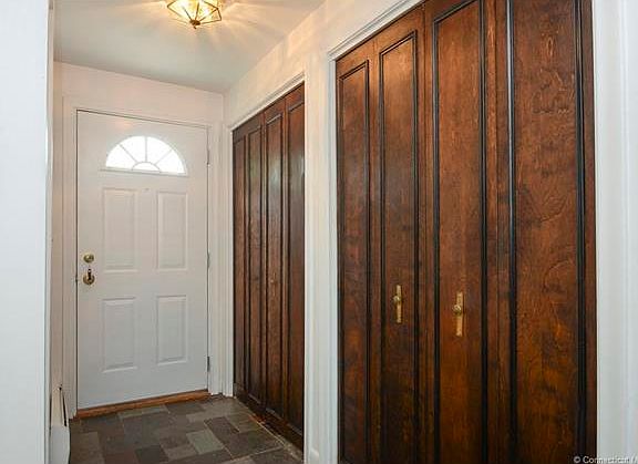 Entrance way with two close...