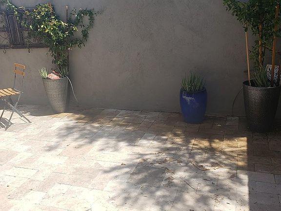 800 sq foot travertine partial covered secured patio