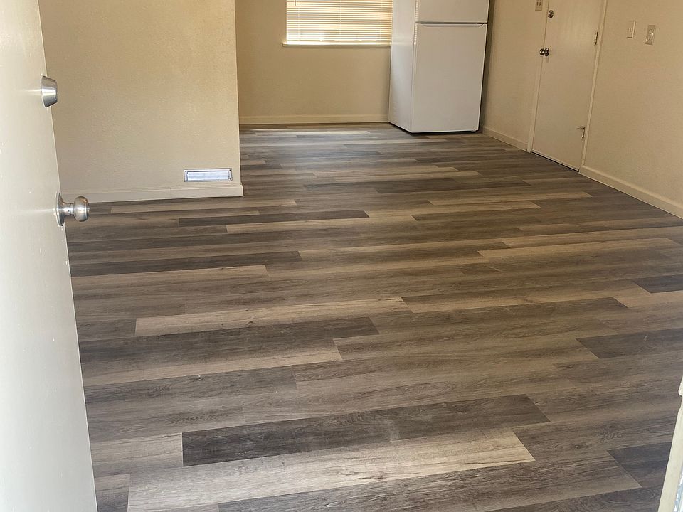 Entry door has a closet behind it for storage and flows into the kitchen