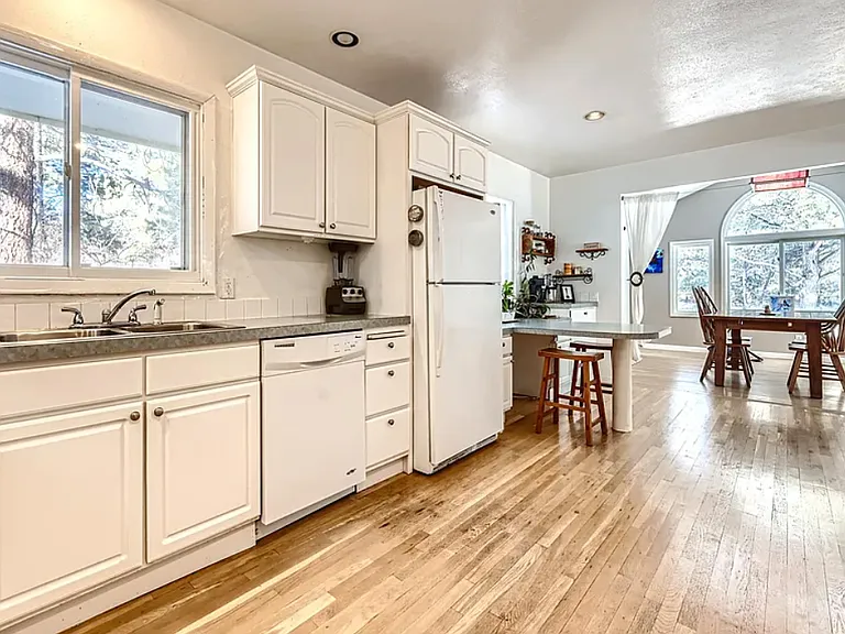 small dining nook seats 2, large dining room and dining table seats 4-6.