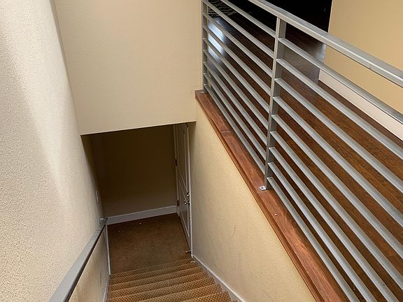 Unit door at bottom of stairs