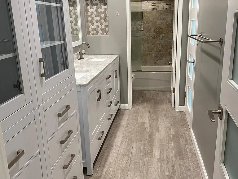 Beautiful updated bathroom and rain shower head.