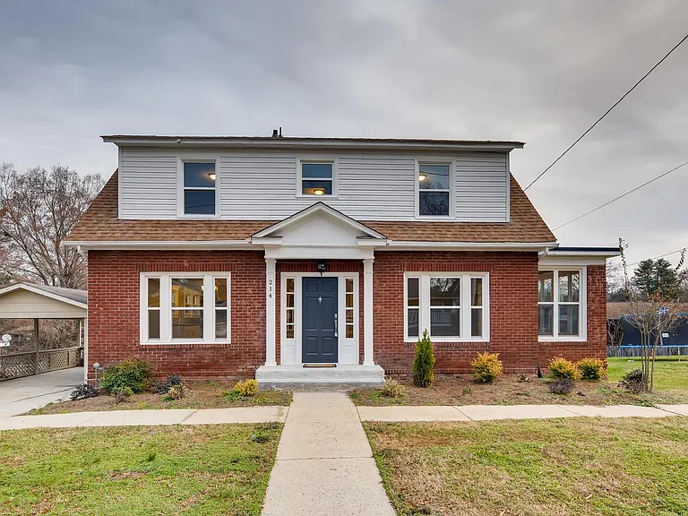 Lovely brick home with covered carport.