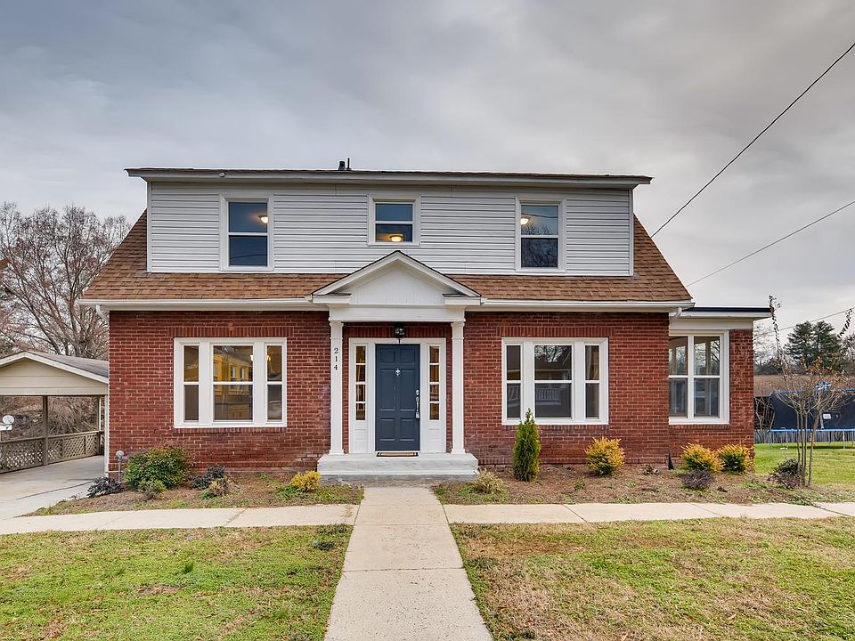 Lovely brick home with covered carport.