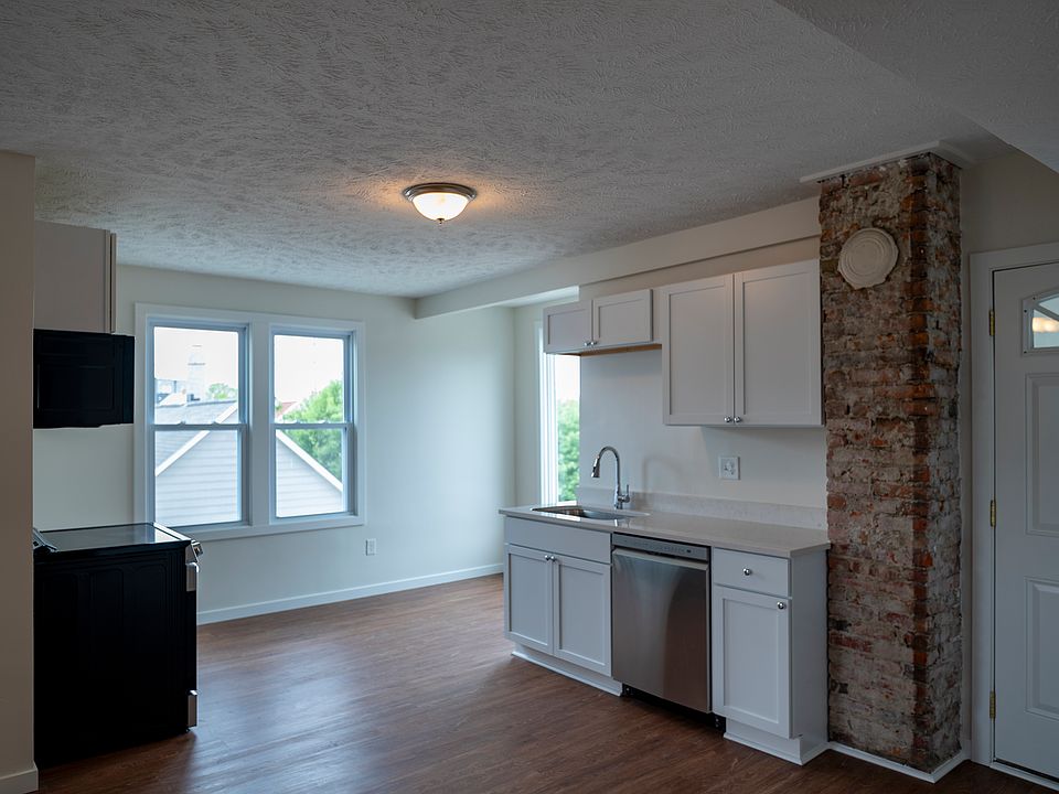 Large brand new kitchen with breakfast nook. Large, ample windows make this space light and bright with views of the neighborhood.