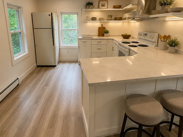 Completely renovated new kitchen with quartz countertops! Vews of Waukewan canal.