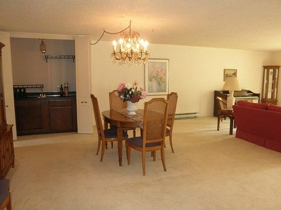 Dining area space accommodates spacious table, china cabinet, and more!! You have a wet bar that can