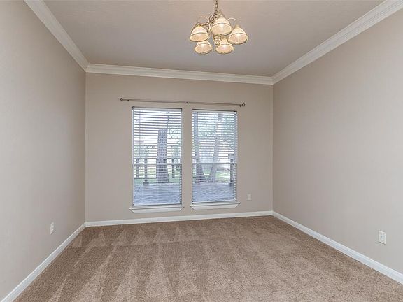 Adjoining the front living area is this large room. It could be a study because it has french doors, or you could use it as a formal dining room.