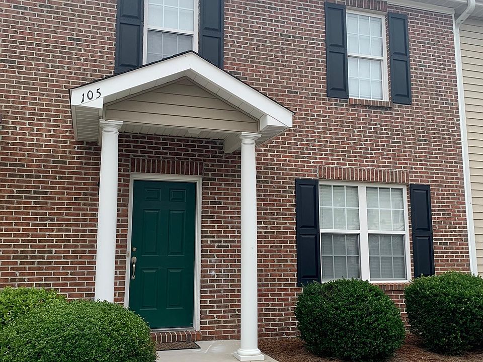 Townhome entrance with 2 reserved parking spaces at your front door