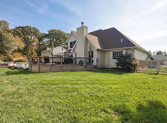 Large, fenced backyard with Maintenance free decking, pool and Hot Tub.
