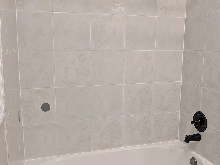 Hall bathroom with tub and shower