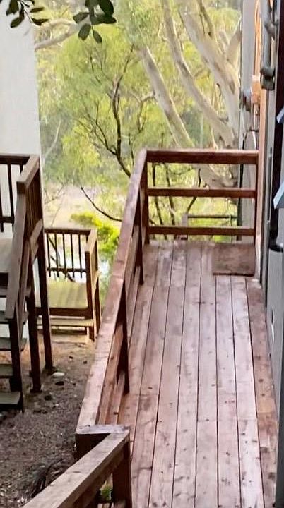 Entry, redwood deck and stairs going down