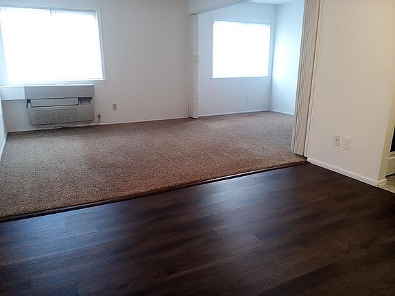 Living room with slider to den