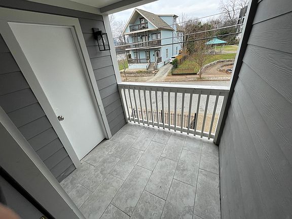 Front patio off of living room with storage closet.