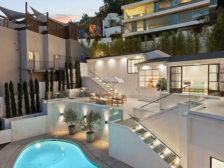 Take a dip in the sparkling pool surrounded by serene hillside views.