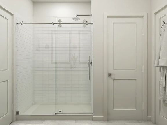 Primary bath with glass shower enclosure