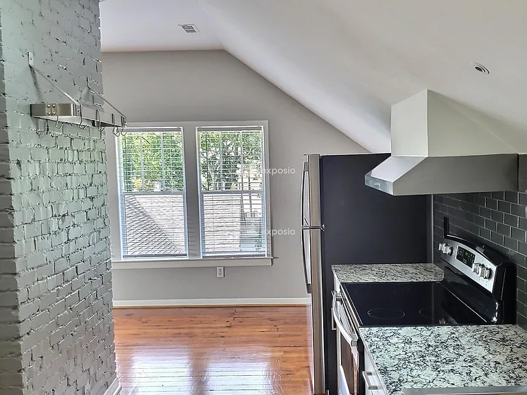 Galley Style kitchen & dining area. Perfect for a breakfast table. TALL CEILING & SKYLIGHT