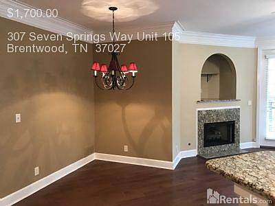 Dining area, granite fireplace.
