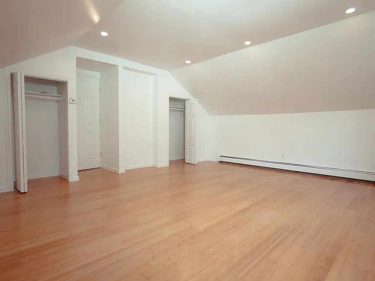 Spacious primary bedroom on second floor. Bamboo floors. Lots of closet space. Plenty of light. Newly renovated.