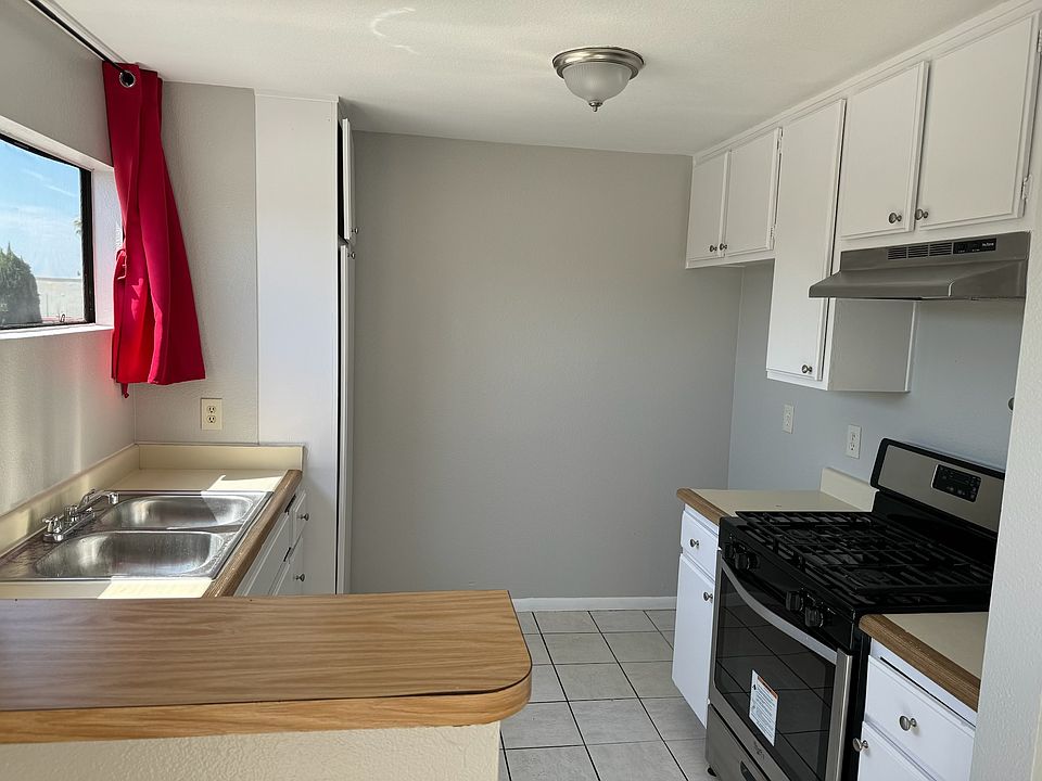 Brightly lit kitchen with new oven