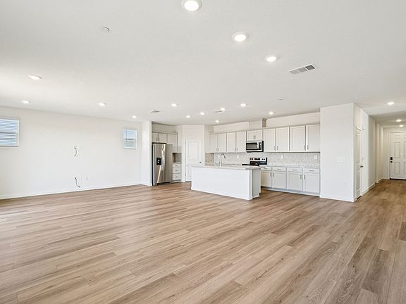 Residence 1 Open Concept kitchen, dining, and living room.