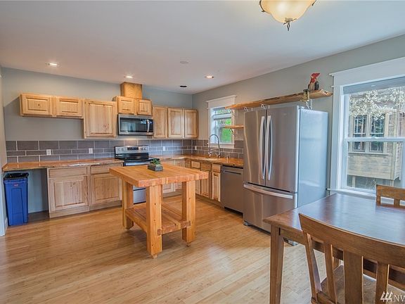 Large kitchen with attached dining area.