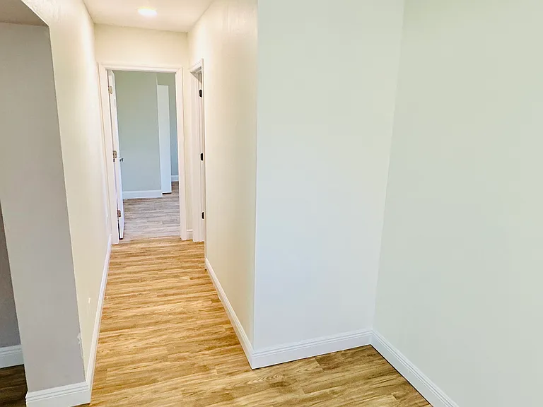 Hallway to back bedrooms