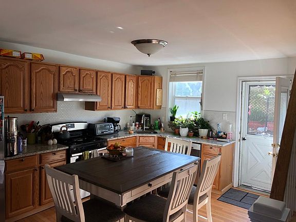 Kitchen with dining table and door to the back yard