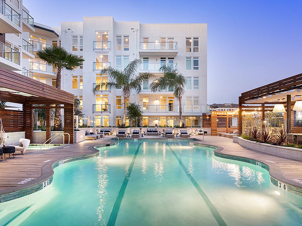 Swimming pool with lounges and cabana seating