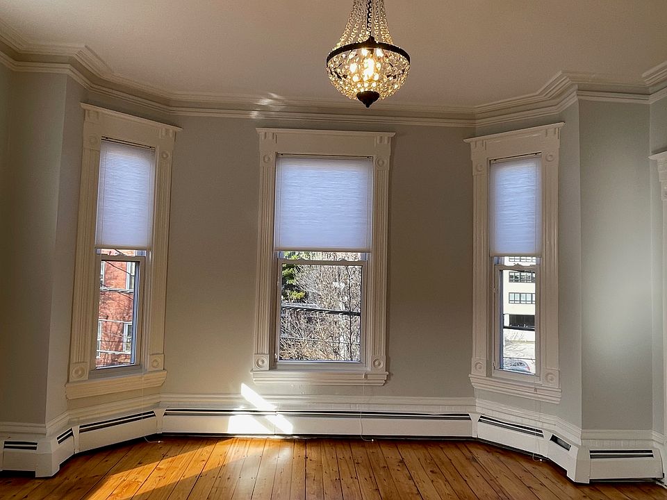 Front bedroom with beautiful plaster medallion and trim.