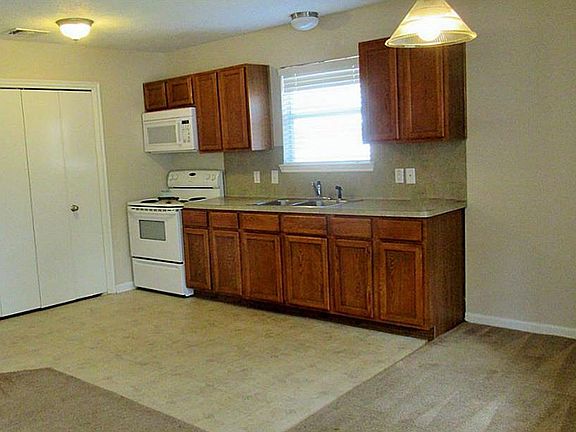 kitchen with eating area open to living room