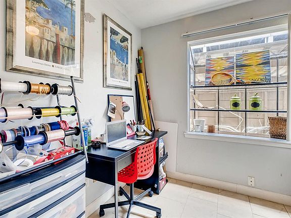 Breakfast Nook (currently used as an office) with garden window looking into back patio.