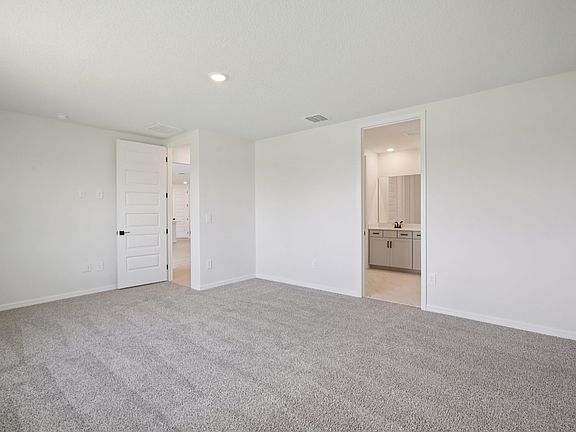The Jasmine Floorplan Primary Bedroom Represented at Two Rivers