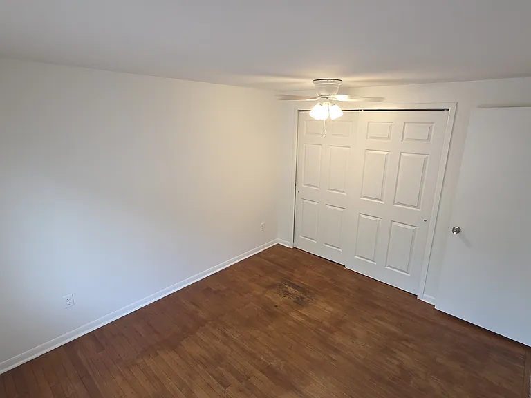 Second bedroom with wide closet and flexible furniture layout.