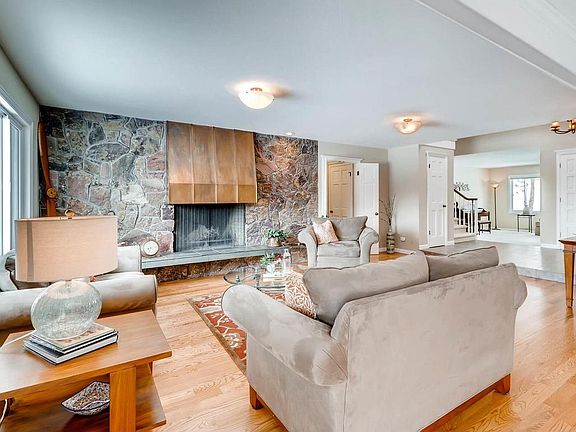 Great room.  Hardwood floor. Wood burning fireplace.