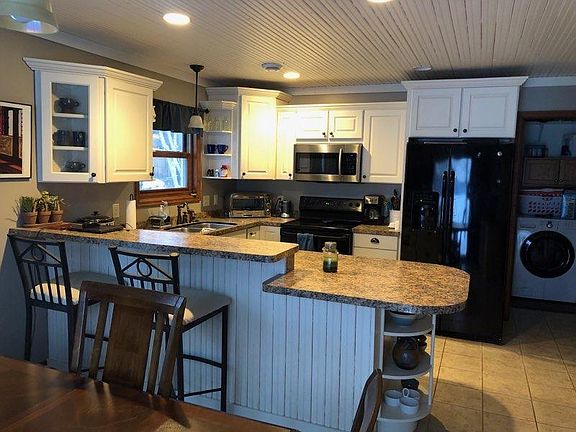 kitchen with gas oven, garbage disposal, dishwasher. Main floor laundry with Washer/Dryer hook ups