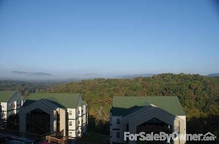 View off the back deck.
						:
						Beautiful view of the Ozark hills off the back deck.