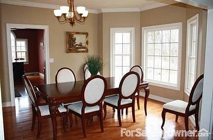Formal Dining Room : This room boasts a bay window to add extra space for family gatherings.