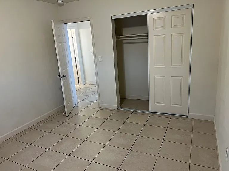 Another view of master bedroom with closet