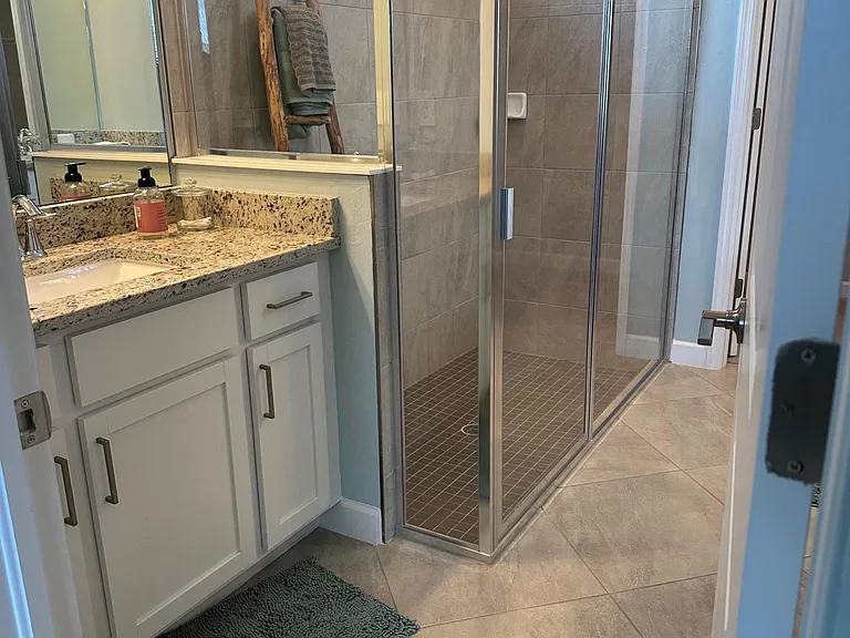 Master bath - this photo shows glass shower but available unit has tiled walk in