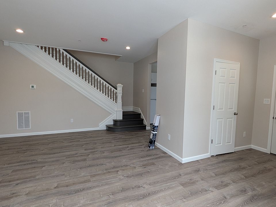 spacious and bright living room and dining room off of the front entrance (coat closet in the entryway)