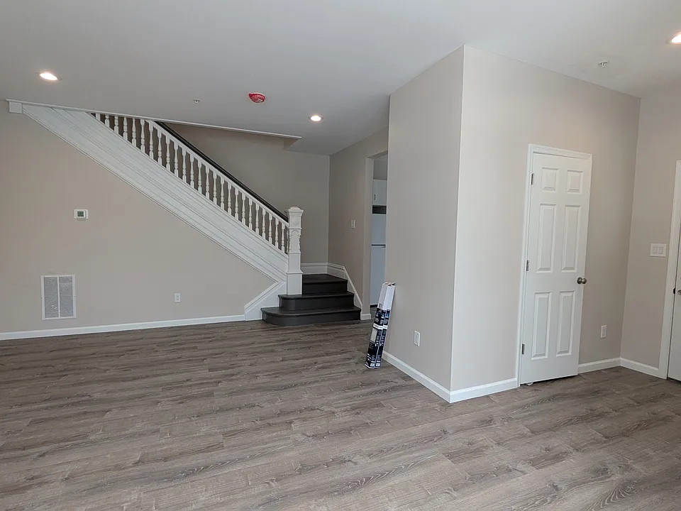 spacious and bright living room and dining room off of the front entrance (coat closet in the entryway)