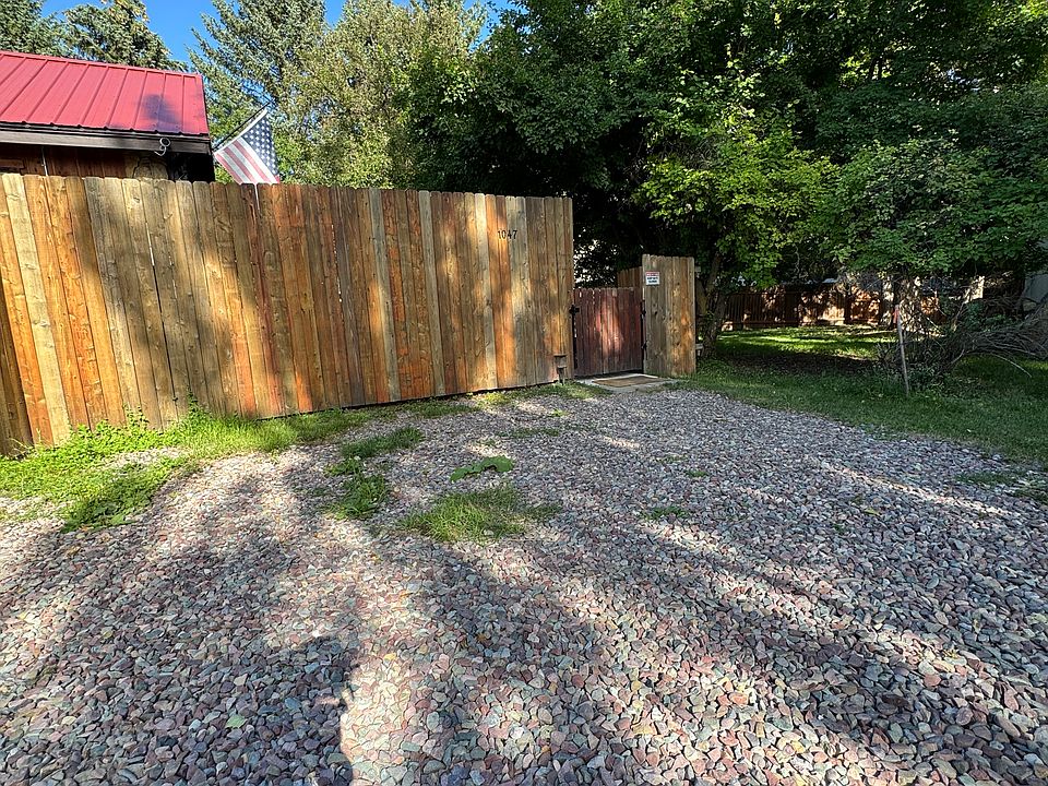 Gated entry, with gravel parking spot