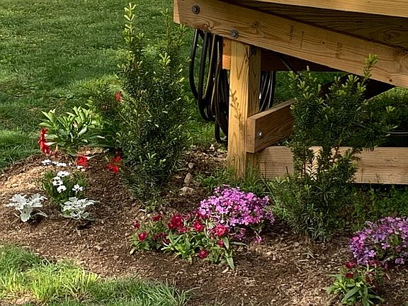 Flower bed below front deck