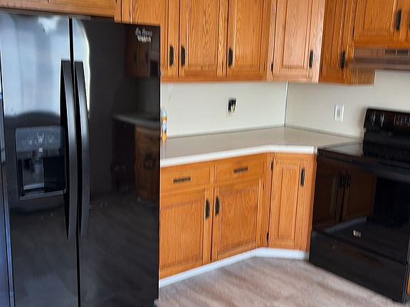 Kitchen with refigerator/freezer and oven/range.