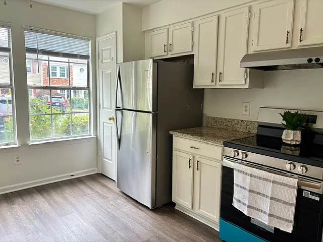Bright eat in kitchen with ample space for dining.