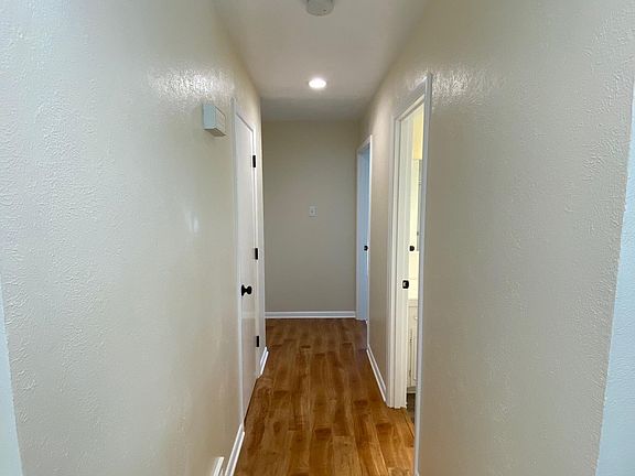 Hallway to the secondary bathroom and bedrooms.