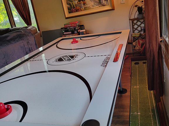 Fun times! Ping pong table slides right on top to switch it up!