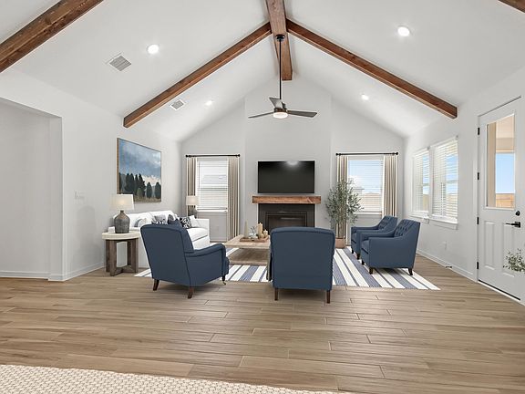 Great room with vaulted ceilings and stained beams