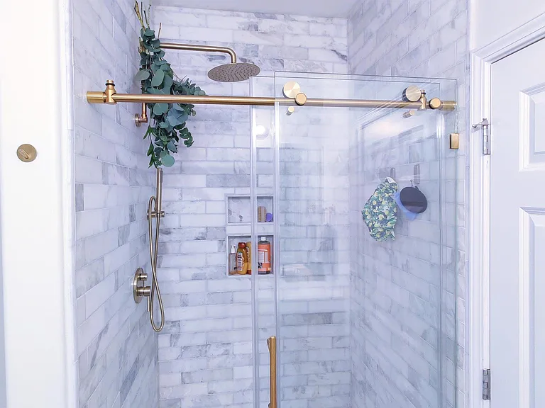 7'foot tall 10 inch thick glass with shower pan and marble tile